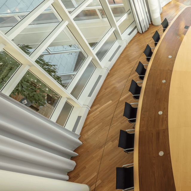 Large round meeting table seen from above HVK Stevens