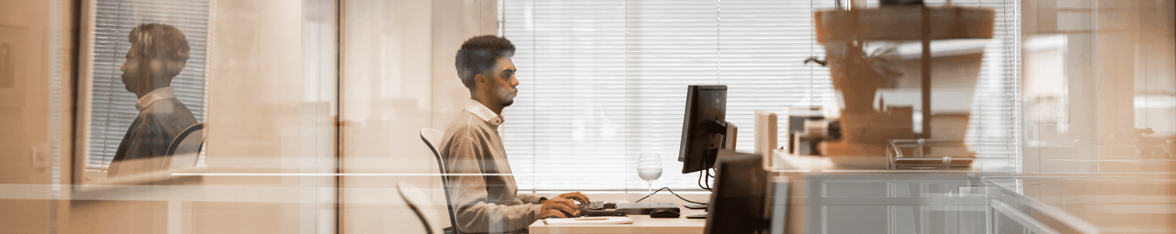 Employee at desk computer screen