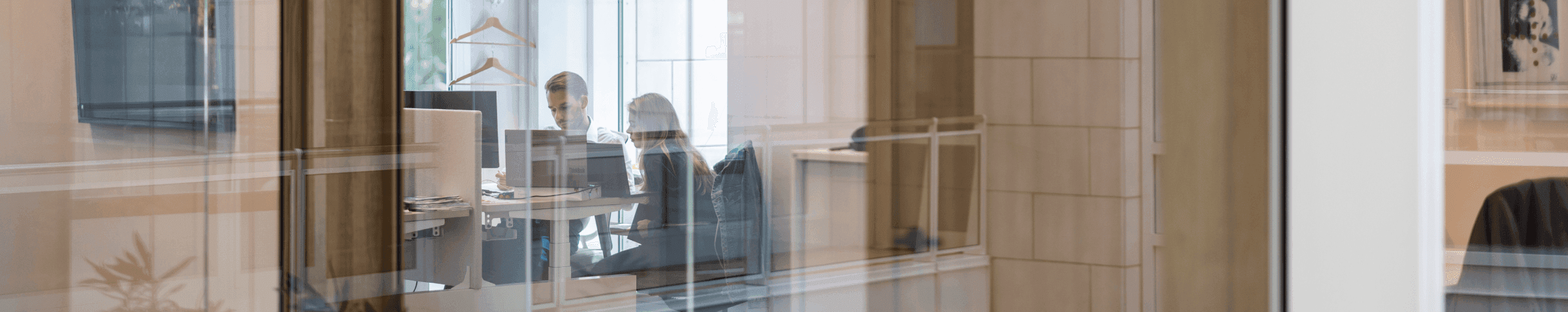 Two colleagues working in modern office space